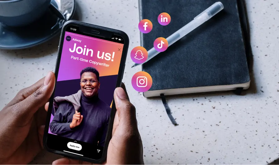 Hand holding a phone showing a branded social job ad with the headline Join us